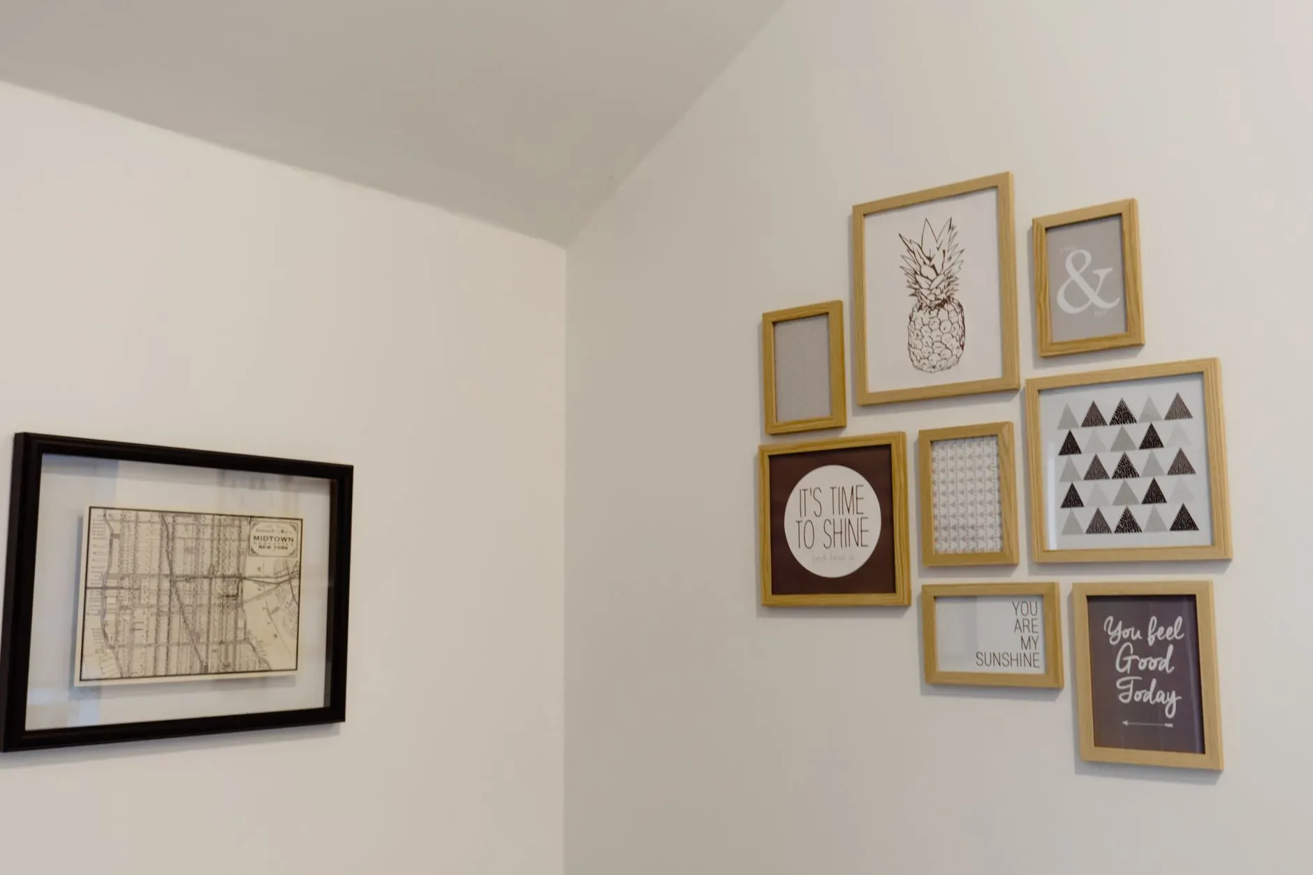 A chic arrangement of picture frames on a white wall adds a modern touch to your space.