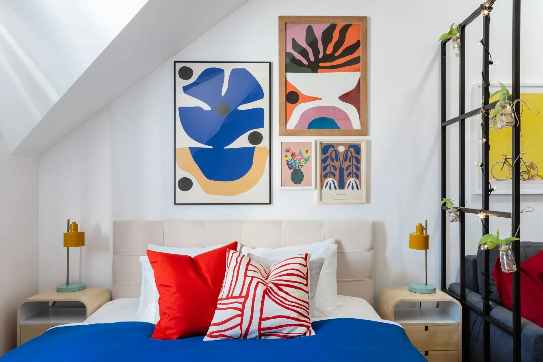 Contemporary bedroom in Prague featuring bold art and colorful decor for a stylish look.