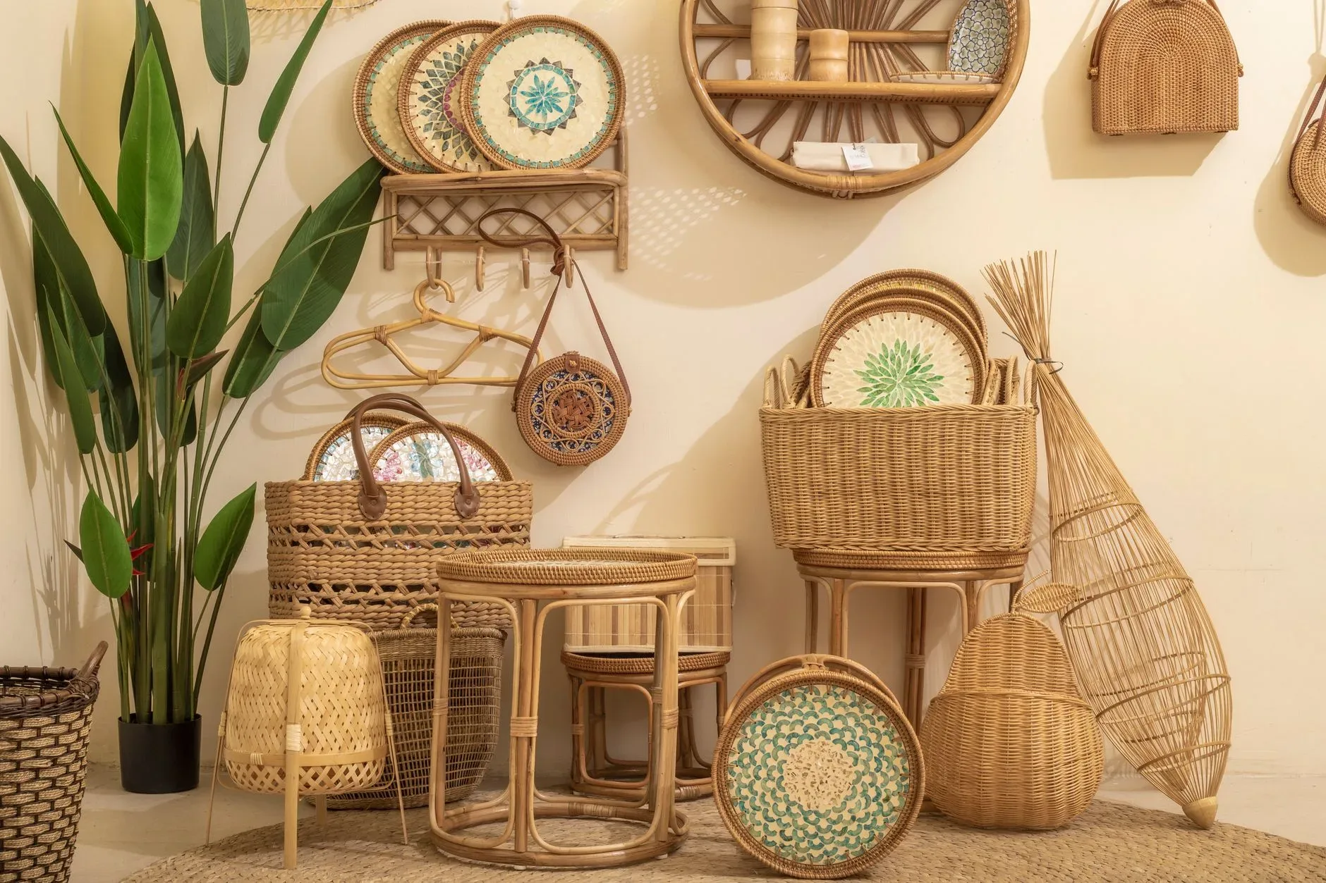 Cozy arrangement of wicker and rattan furniture with greenery indoors.