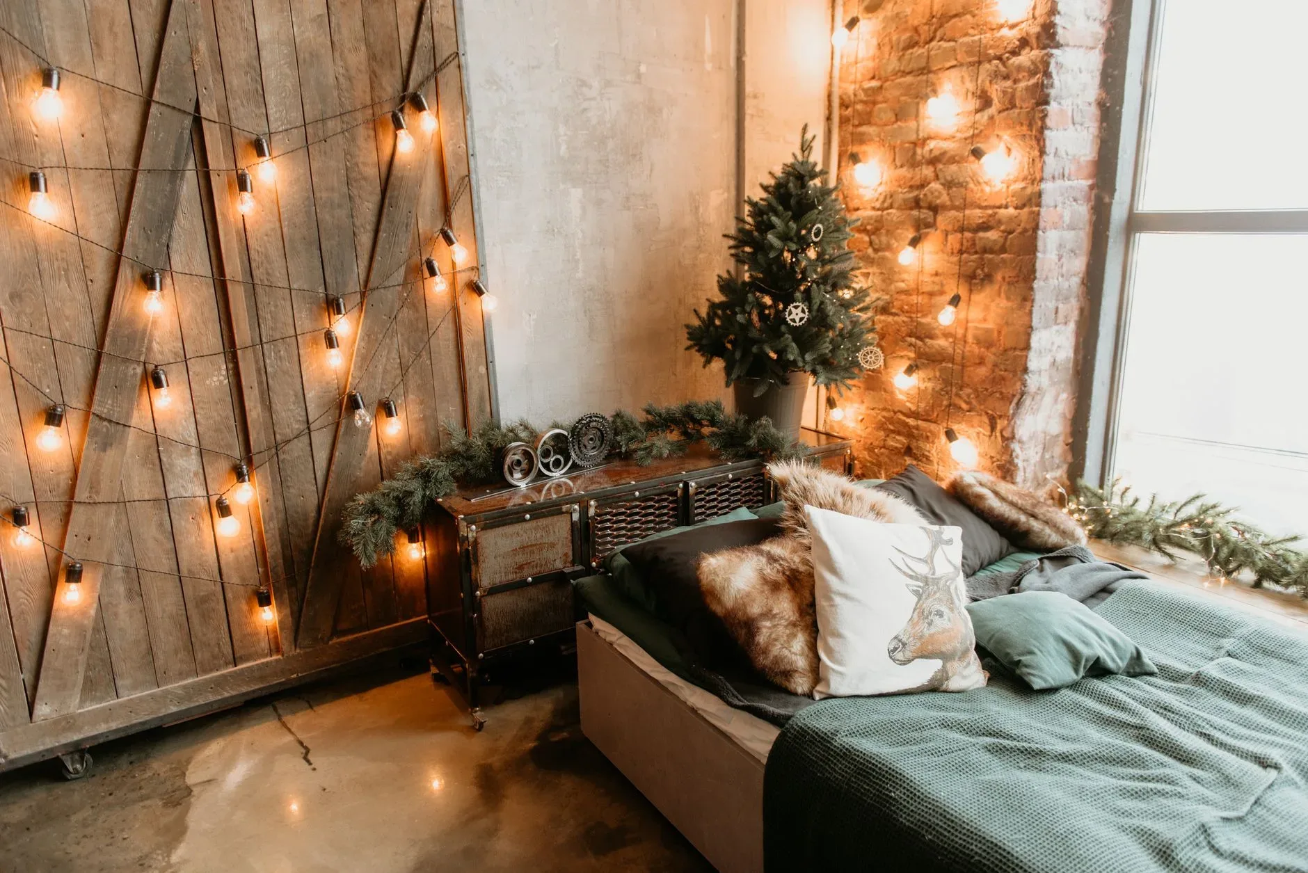 Warm, festive bedroom with Christmas lights and rustic decor, perfect for holiday inspiration.