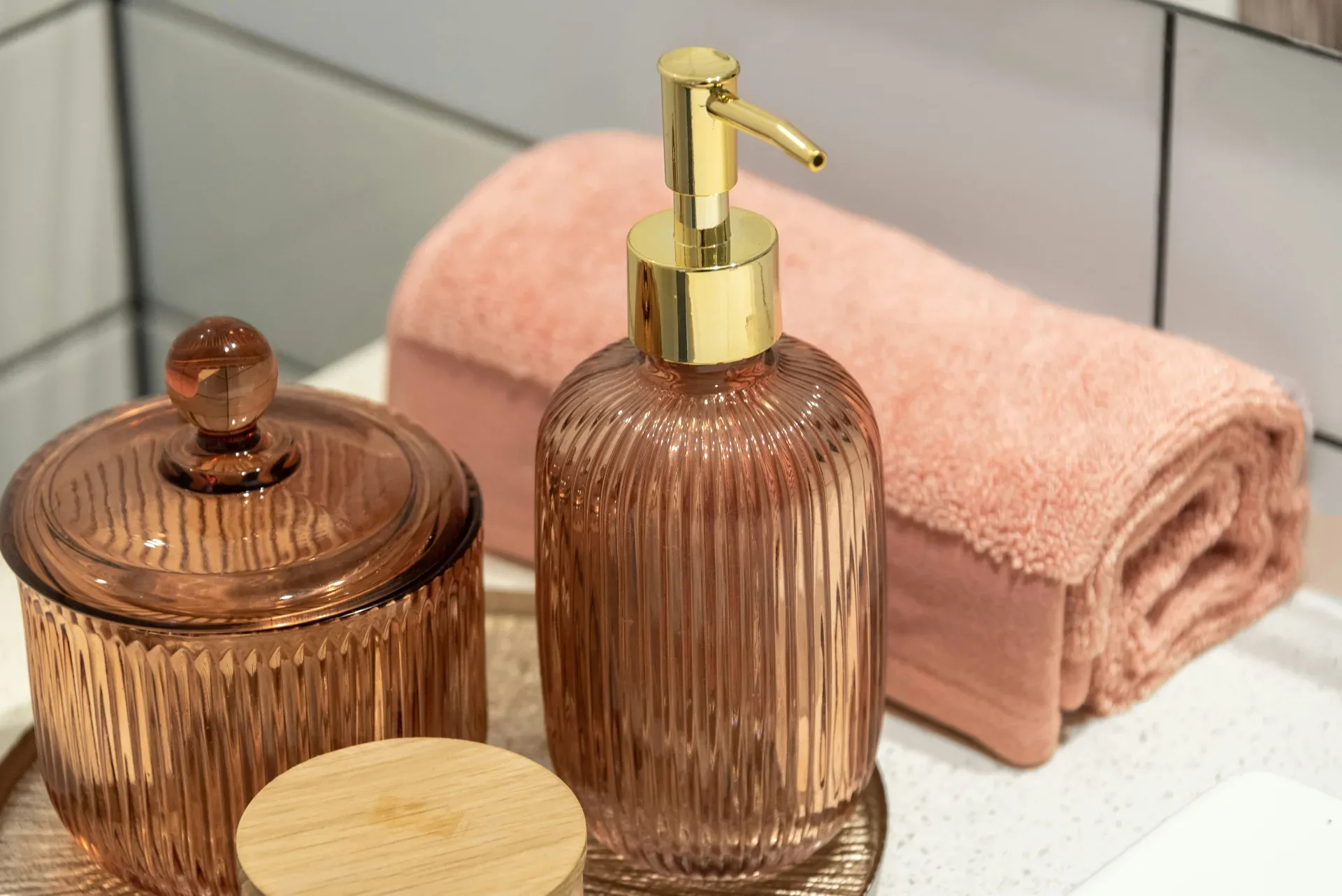 a bathroom sink with a soap dispenser and a soap dish