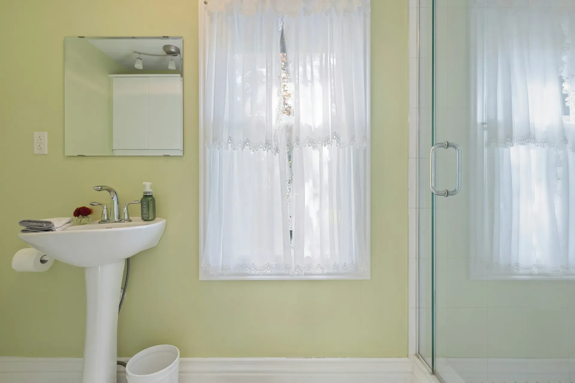 a bathroom with a sink and a shower