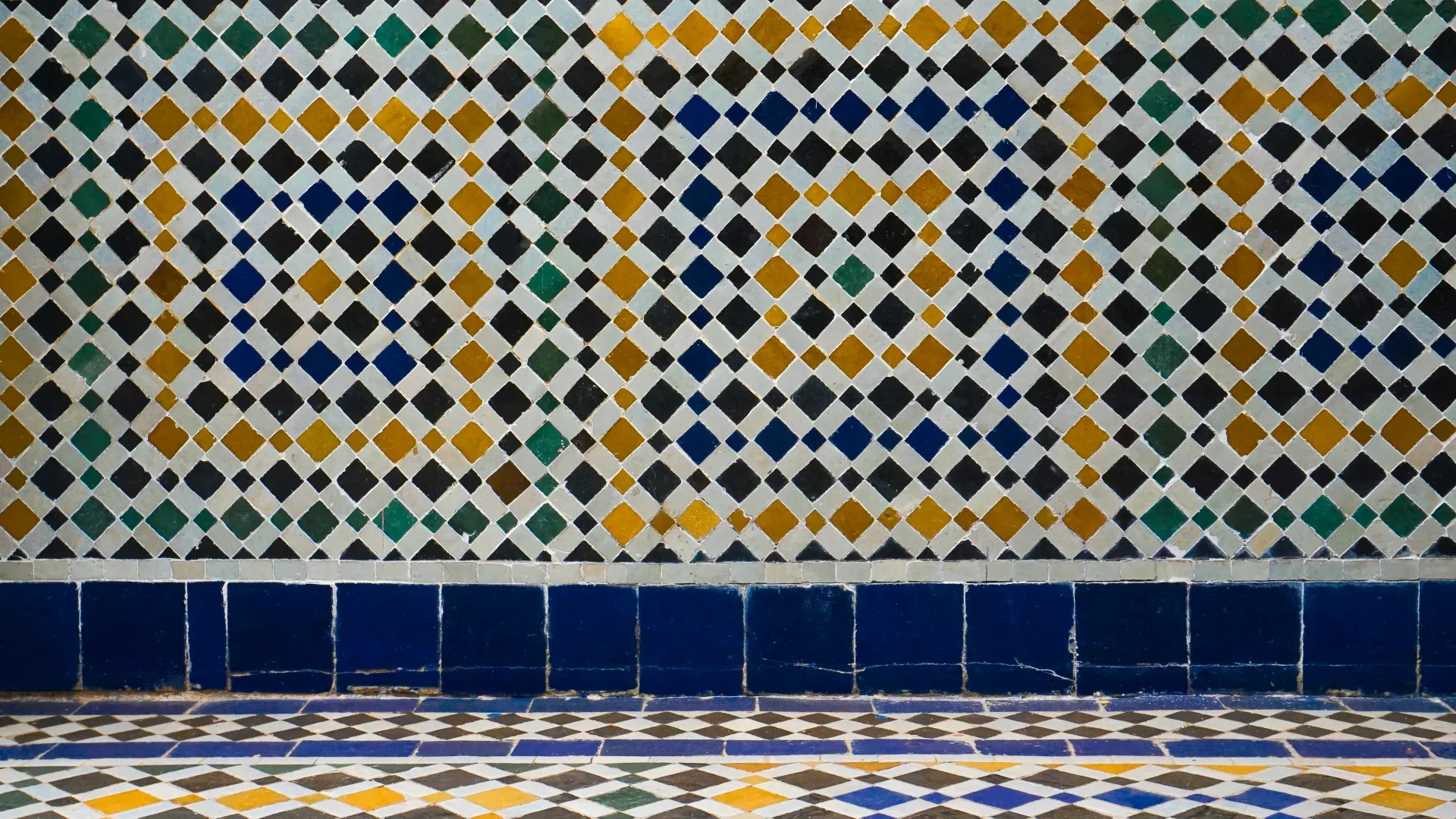 a tiled wall with a colorful pattern on it