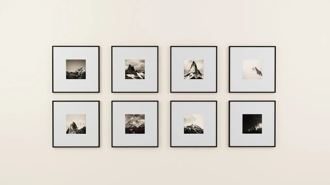 black and white photo grid gallery wall matching frames