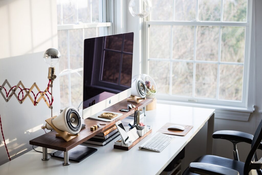 chic home office bright natural light desk setup