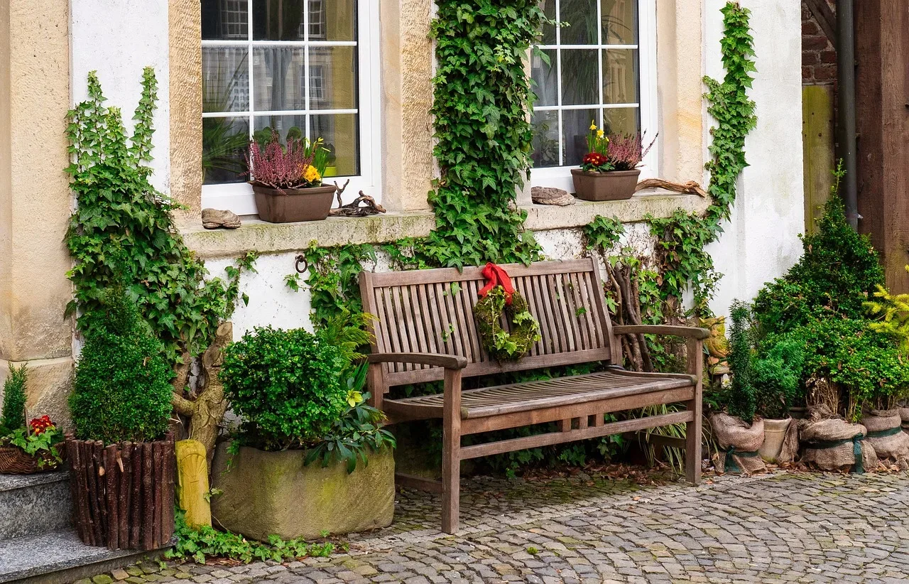 wooden bench front porch spring cushions flowers styled